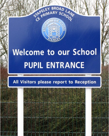a school sign on aluminium posts